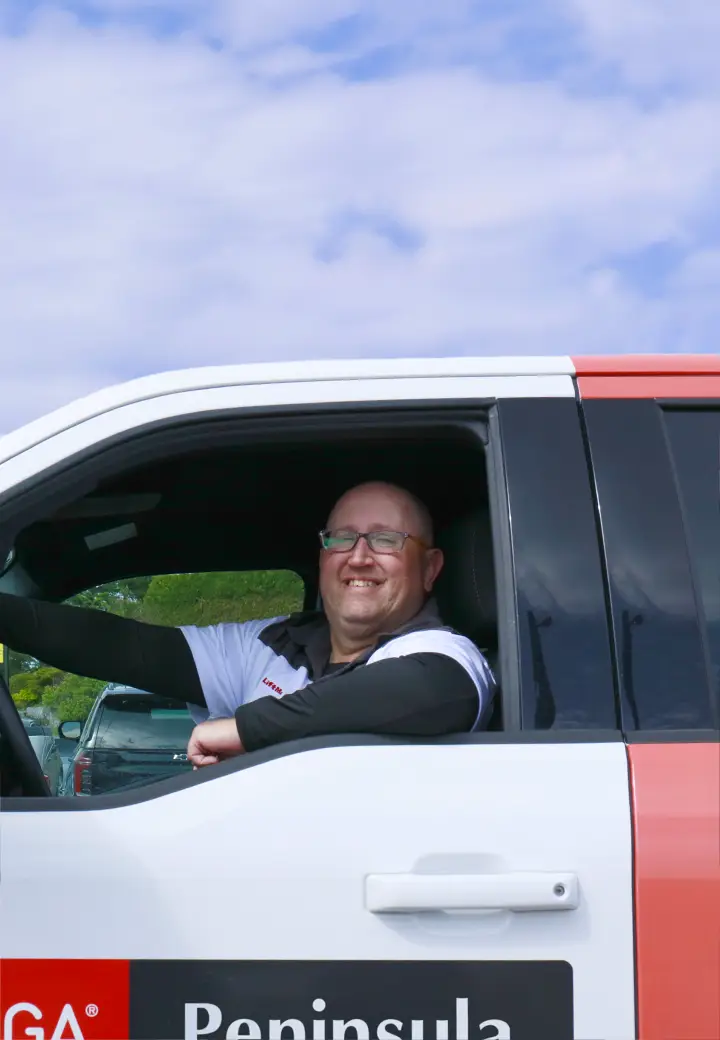 Peninsula Garage Doors Owen Sound technician in his service truck, ready to help.